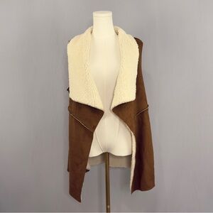 Wrap yourself in effortless rustic charm with brown faux open front vest!